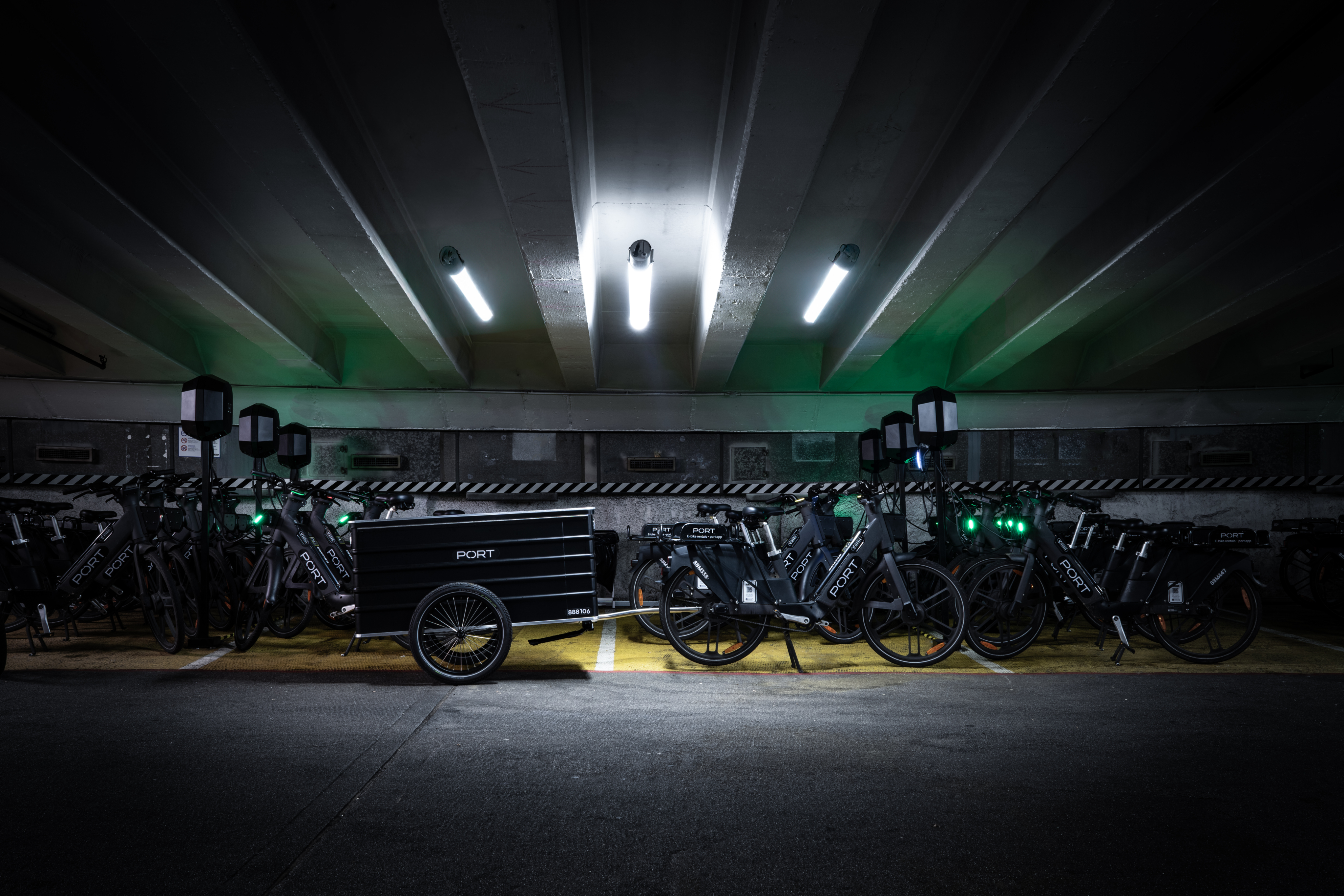 PORT fleet, including chargers, e-bikes and trailers, inside a repurposed facility